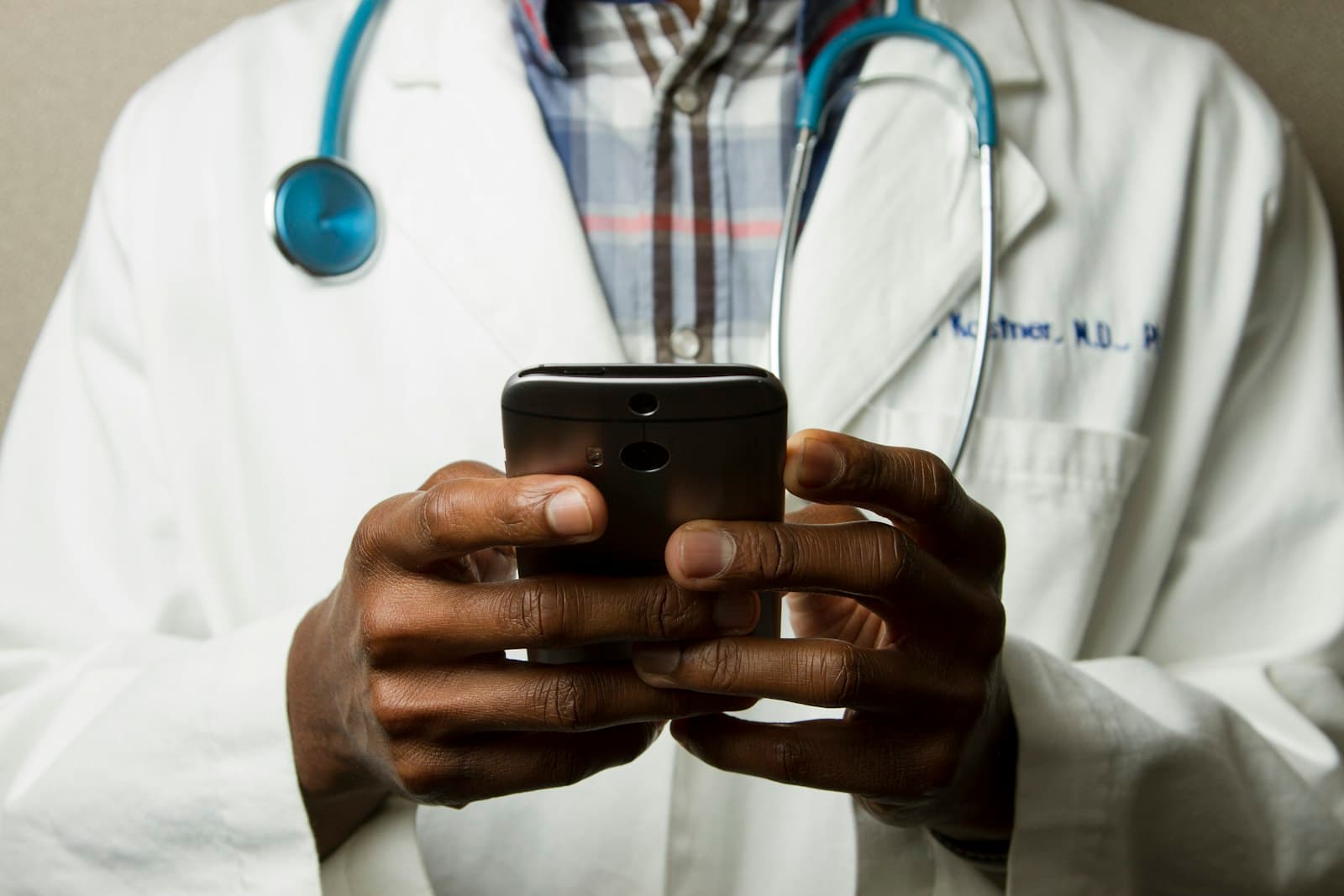 Medical research professional reviewing data on a digital tablet
